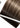 Detailansicht der Genius Wefts Tresse in Luis Velvet Brown mit Tape-Streifen – Rubin Extensions®