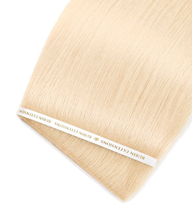 Close-up of glossy Honey Blonde human hair strands, Genius Weft – Rubin Extensions®